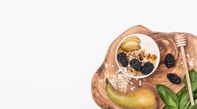 top-view-yogurt-with-oats-fruits-honey-with-copy-space(1)